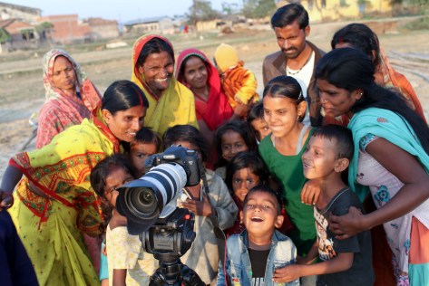 Villagers gathered round the Camera